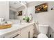 Modern bathroom with white cabinets, quartz countertop, and marble shower at 4818 El Tesoro Ave, Las Vegas, NV 89121