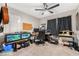 Bright bedroom with workspace, fish tank, and ample natural light at 4818 El Tesoro Ave, Las Vegas, NV 89121