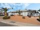 Newly painted house with mature palm trees at 4818 El Tesoro Ave, Las Vegas, NV 89121