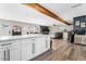 Modern kitchen with white cabinets and breakfast bar at 4818 El Tesoro Ave, Las Vegas, NV 89121