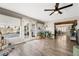 Bright living area with French doors opening to the backyard and a view to the dining area at 4818 El Tesoro Ave, Las Vegas, NV 89121