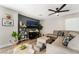 Modern living room featuring a large TV and house plants at 4818 El Tesoro Ave, Las Vegas, NV 89121