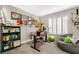 Home office with built-in shelving, a large desk, and a comfortable beanbag chair at 4818 El Tesoro Ave, Las Vegas, NV 89121