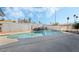 Inviting kidney-shaped pool with patio and surrounding landscaping at 4818 El Tesoro Ave, Las Vegas, NV 89121