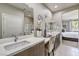 Double vanity bathroom with walk-in shower and view to bedroom at 4884 E Cactus Canyon Dr, Pahrump, NV 89061