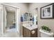 Modern bathroom with vanity, toilet, and view into hallway at 4884 E Cactus Canyon Dr, Pahrump, NV 89061