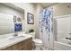 Clean bathroom with shower/tub combo, vanity, and floral shower curtain at 4884 E Cactus Canyon Dr, Pahrump, NV 89061