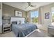Grey bedroom with king-size bed and large window at 4884 E Cactus Canyon Dr, Pahrump, NV 89061