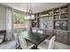 Elegant dining room with a large table and built-in cabinetry at 4884 E Cactus Canyon Dr, Pahrump, NV 89061