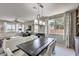 Bright dining room with a large table and modern lighting fixture at 4884 E Cactus Canyon Dr, Pahrump, NV 89061