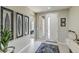 Bright and airy entryway with tile flooring and modern wall art at 4884 E Cactus Canyon Dr, Pahrump, NV 89061