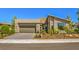 Single story home with attached garage and desert landscaping at 4884 E Cactus Canyon Dr, Pahrump, NV 89061