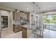 Modern kitchen with granite counters, island, and stainless steel appliances at 4884 E Cactus Canyon Dr, Pahrump, NV 89061