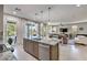 Modern kitchen with island, granite counters, and stainless steel appliances at 4884 E Cactus Canyon Dr, Pahrump, NV 89061