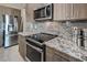 Kitchen boasts stainless steel appliances and granite countertops at 4884 E Cactus Canyon Dr, Pahrump, NV 89061