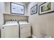 Convenient laundry room with washer, dryer, and shelving at 4884 E Cactus Canyon Dr, Pahrump, NV 89061