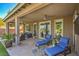 Spacious covered patio with lounge seating, ceiling fans, and access to the pool at 4884 E Cactus Canyon Dr, Pahrump, NV 89061