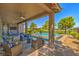 Relaxing covered patio overlooking the pool and golf course at 4884 E Cactus Canyon Dr, Pahrump, NV 89061