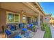 Relaxing covered patio with comfortable seating and lush landscaping at 4884 E Cactus Canyon Dr, Pahrump, NV 89061