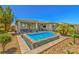 Modern rectangular pool in a beautifully landscaped backyard at 4884 E Cactus Canyon Dr, Pahrump, NV 89061