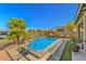 Inviting backyard pool with stone coping and mountain views at 4884 E Cactus Canyon Dr, Pahrump, NV 89061
