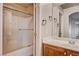 Clean bathroom, shower/tub combo, vanity with wood cabinets at 6336 Fence Post St, Las Vegas, NV 89148