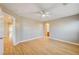 Primary bedroom with wood floors, ceiling fan, and access to bathroom at 6336 Fence Post St, Las Vegas, NV 89148