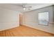 Bright bedroom with wood floors, ceiling fan, and window blinds at 6336 Fence Post St, Las Vegas, NV 89148