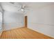 Well-lit bedroom with wood floors and a ceiling fan at 6336 Fence Post St, Las Vegas, NV 89148