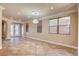 Elegant dining room with tile floors and double entry doors at 6336 Fence Post St, Las Vegas, NV 89148