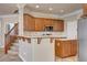 View of kitchen with island and stainless steel appliances at 6336 Fence Post St, Las Vegas, NV 89148