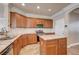 L shaped kitchen with island and granite countertops at 6336 Fence Post St, Las Vegas, NV 89148