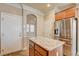 Kitchen with island and stainless steel refrigerator at 6336 Fence Post St, Las Vegas, NV 89148