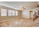 Spacious living room with tile floors and ceiling fan at 6336 Fence Post St, Las Vegas, NV 89148