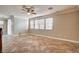Living area featuring tile floors, crown molding, and large windows at 6336 Fence Post St, Las Vegas, NV 89148