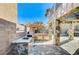 Stone outdoor kitchen next to pool and spa at 6336 Fence Post St, Las Vegas, NV 89148