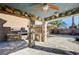 Covered outdoor kitchen with stone finishes at 6336 Fence Post St, Las Vegas, NV 89148