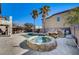 Inviting pool and spa with rock waterfall feature at 6336 Fence Post St, Las Vegas, NV 89148