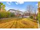 Spacious backyard with grassy area and basketball court at 7258 Sashaying Spirit Ct, Las Vegas, NV 89131