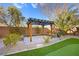 Backyard patio with pergola and putting green at 7258 Sashaying Spirit Ct, Las Vegas, NV 89131