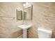Powder room with pedestal sink and updated tile at 7258 Sashaying Spirit Ct, Las Vegas, NV 89131