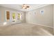 Spacious bedroom with carpeting, ceiling fan, and access to backyard at 7258 Sashaying Spirit Ct, Las Vegas, NV 89131