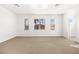 Well-lit bedroom with neutral walls and carpet flooring at 7258 Sashaying Spirit Ct, Las Vegas, NV 89131