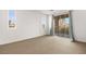 Spacious bedroom with sliding glass doors to balcony at 7258 Sashaying Spirit Ct, Las Vegas, NV 89131