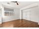Simple bedroom with wood flooring and closet at 7258 Sashaying Spirit Ct, Las Vegas, NV 89131