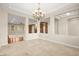 Elegant dining room with chandelier and view to living room at 7258 Sashaying Spirit Ct, Las Vegas, NV 89131
