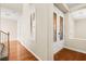 Bright entryway with hardwood floors, elegant double doors, and staircase at 7258 Sashaying Spirit Ct, Las Vegas, NV 89131