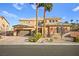 Two-story house with a three car garage and landscaping at 7258 Sashaying Spirit Ct, Las Vegas, NV 89131