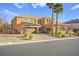 Two-story house with a three car garage and landscaping at 7258 Sashaying Spirit Ct, Las Vegas, NV 89131