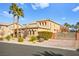 Two-story house with gated entry and palm trees at 7258 Sashaying Spirit Ct, Las Vegas, NV 89131